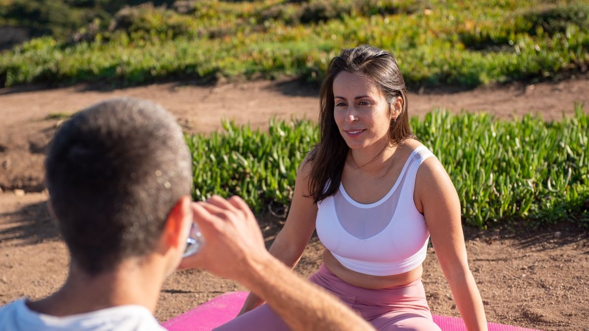 Two friends enjoying an outdoor exercise session in Portugal. Warm and sunny atmosphere.